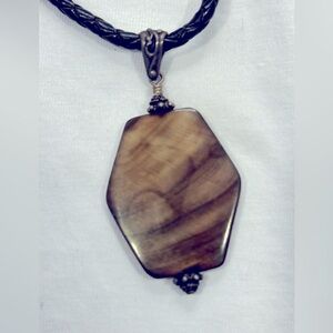 Geometric pendant on leather braided cord necklace